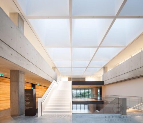 Museum stairway with integrated LED handrail lighting.