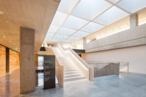 Illuminated stairway with LED handrail at Chau Chak Wing Museum.