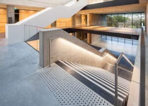 LED-lit handrail on a museum staircase.