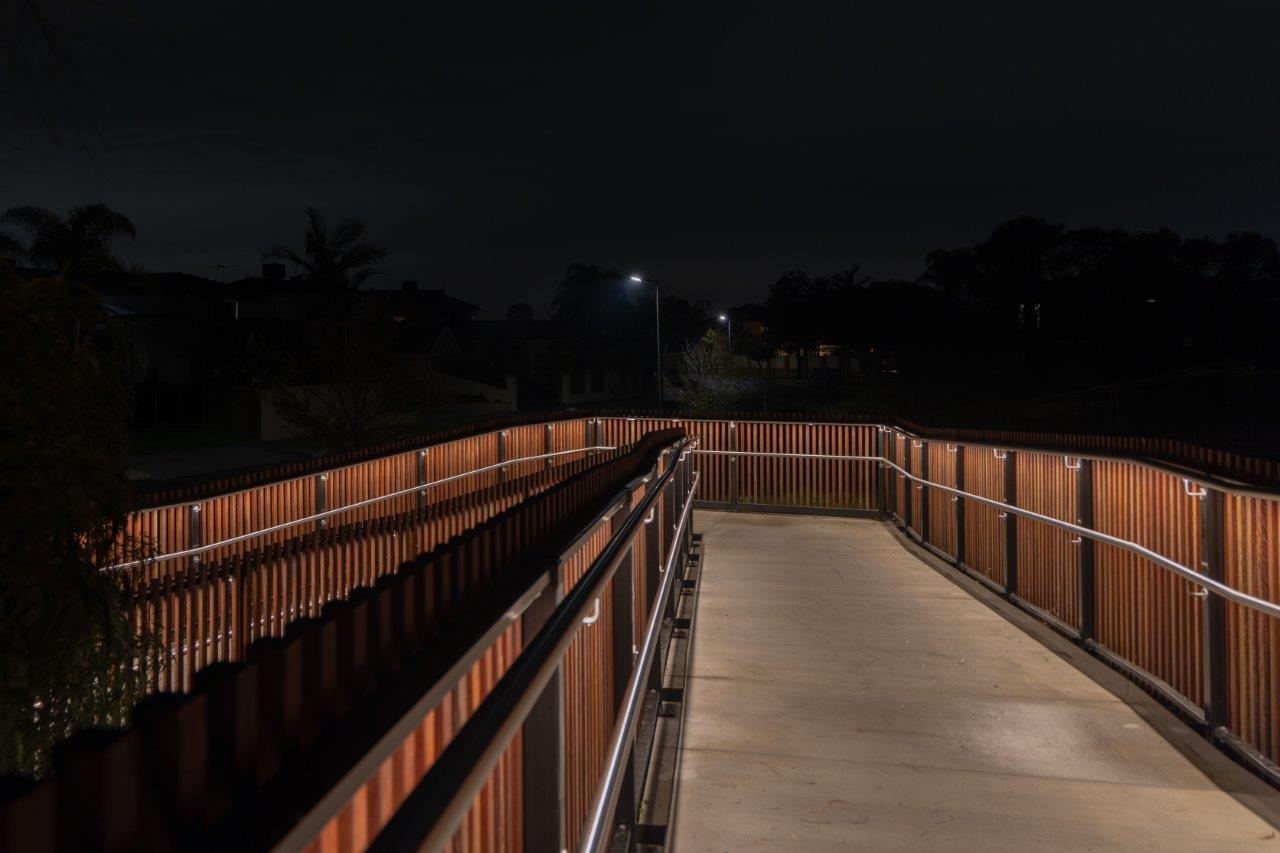 Illuminated walkway with LED handrail at Seaford Wetlands.