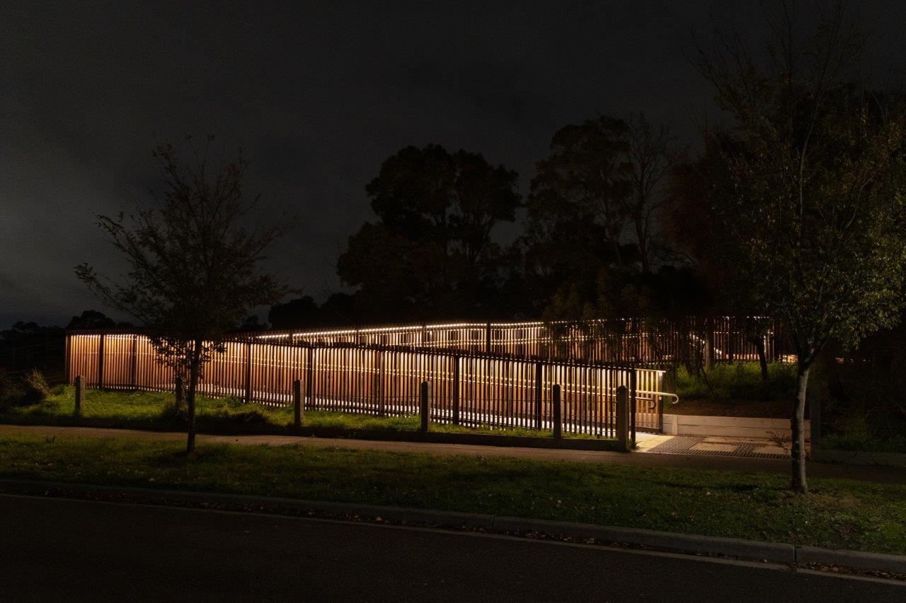 LED handrail system lighting up pathway at Seaford Wetlands.