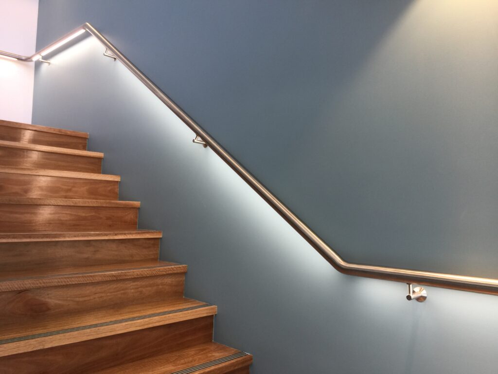 LED handrail on wooden stairs at Mingara Medical Centre.