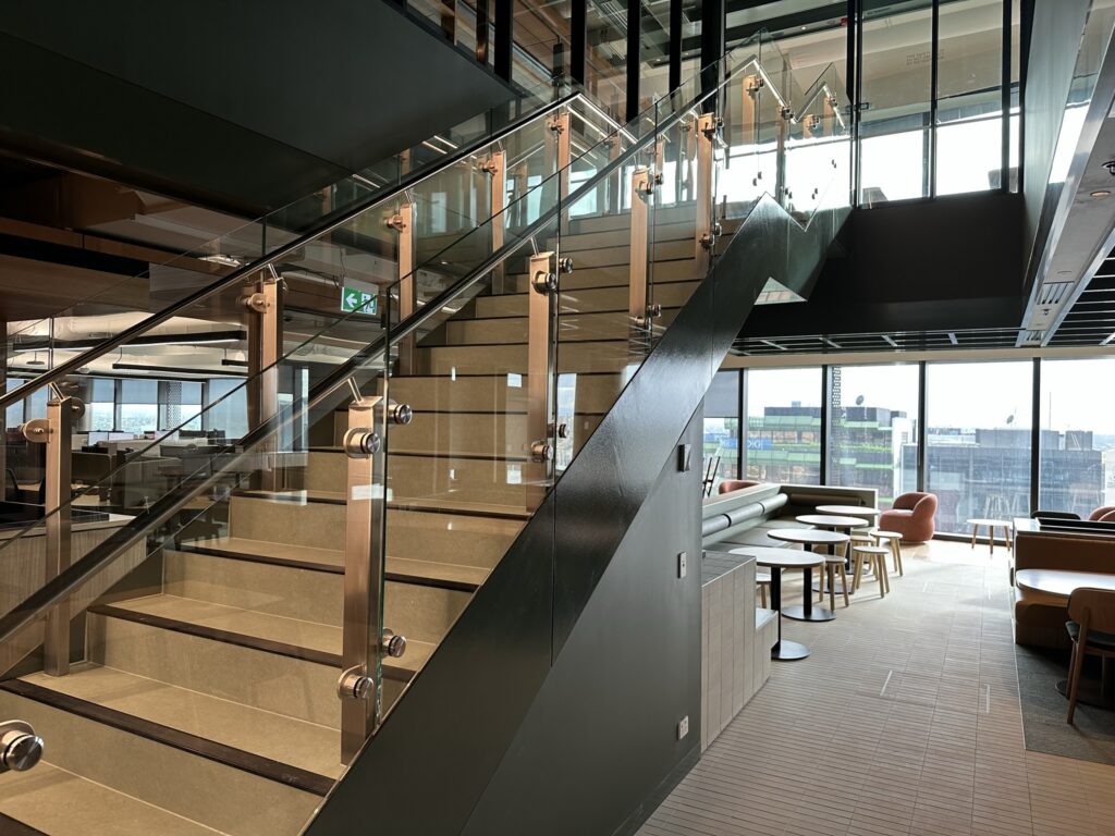 Glass and stainless steel LED handrail system at Elizabeth North office.